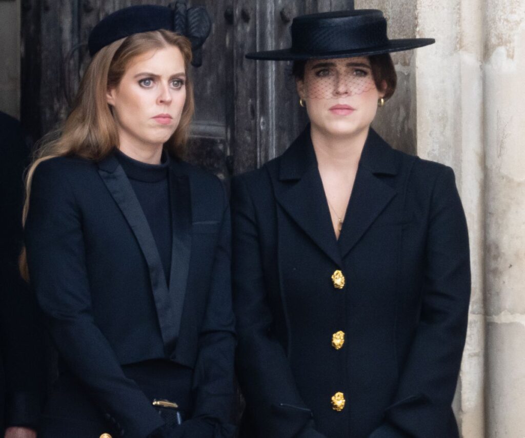 Princess Beatrice and Princess Eugenie looking sombre. 