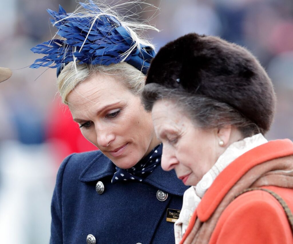 Zara and mom Princess Anne look down with serious expressions upon their faces