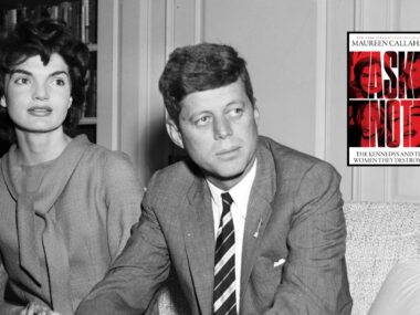 JFK and Janet sit on coach in black and white photo with image of new book