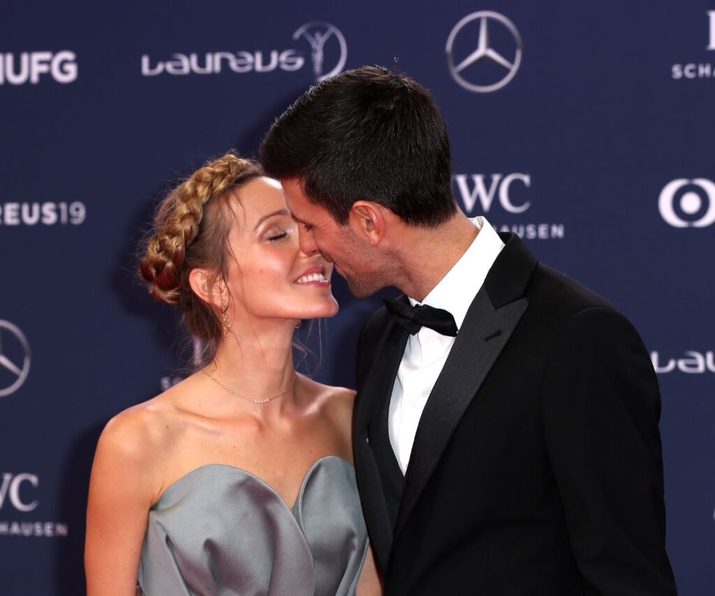 Novak Djokovic kissing his wife Jelena.