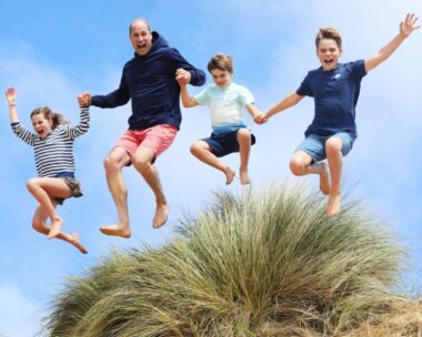 prince william and children jumping holding hands