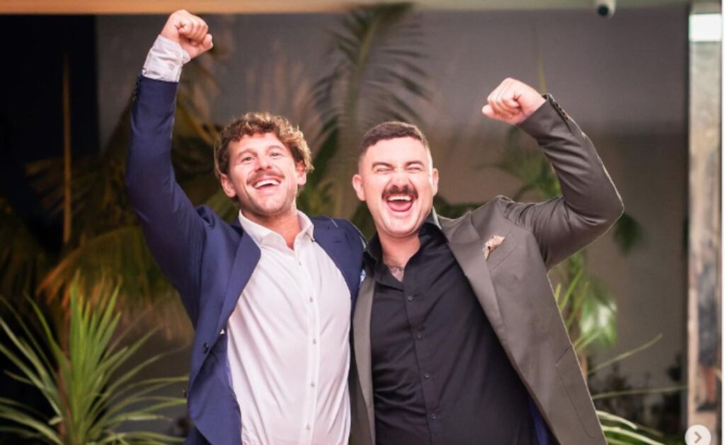 Dream Home winners Rhys and Liam Almond celebrate their win with fists in the air and big smiles