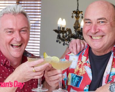 Travel Guides Matt and Brett smile, cheersing their martinis