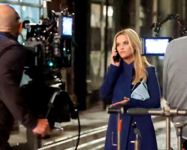 Reese Witherspoon looks upset on the phone filming for Morning Wars