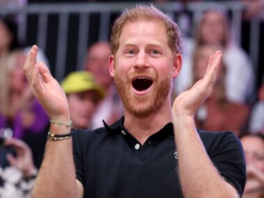 Prince Harry is very happy, clapping mouth open, likely because he's set to inherit millions from Queen Mother