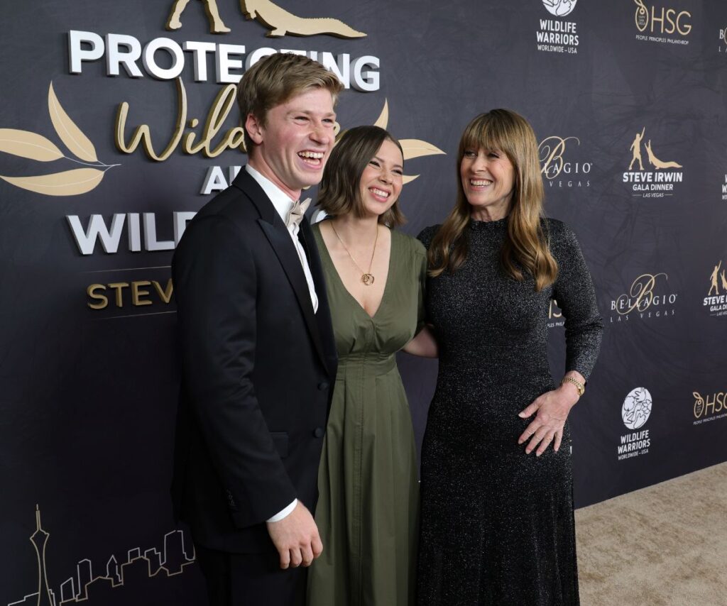 Robert, Bindi and mum Terri smile all dressed up for an event