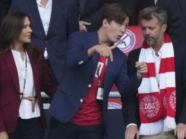Prince Christian with parents at a sporting event