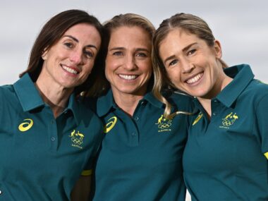 Marathon runners Sinead Diver, Genevieve Gregson and Jessica Stenson smiling to camera.