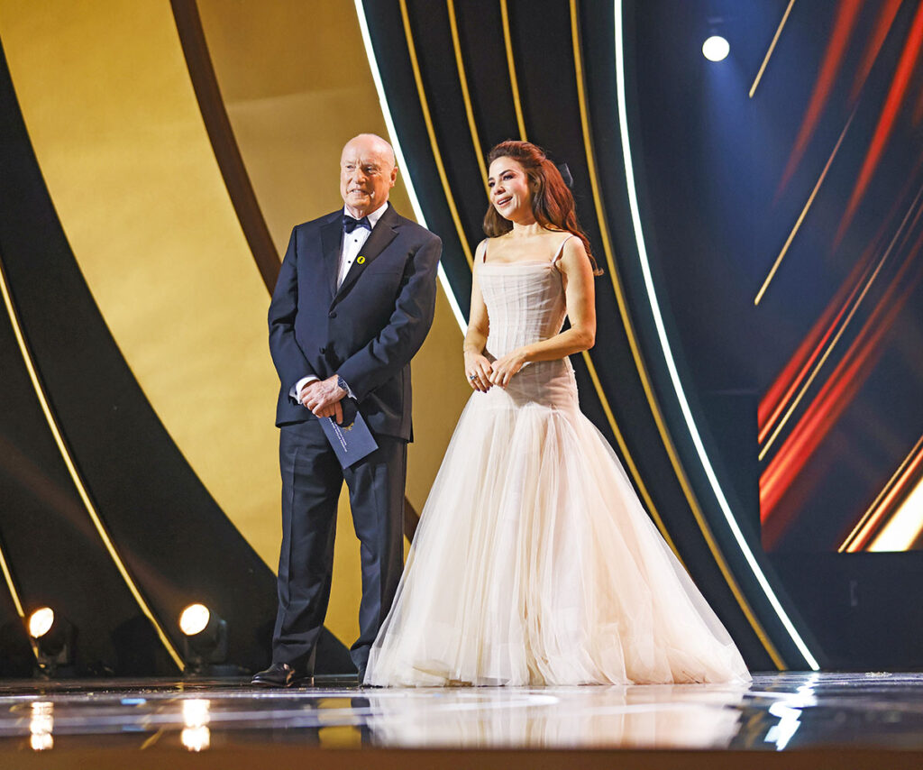 Ray Meagher and Kate Ritchie take to the stage to present at the 64th Logie Awards at The Star in Sydney