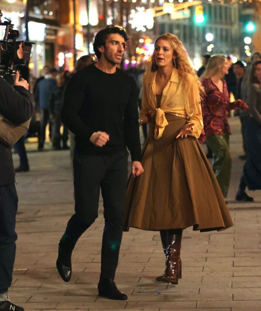 Blake Lively and Justin Baldoni on the set of It Ends With Us, looking in the middle of an argument in the street