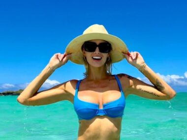 Selling Sunset's Nicole Young sports a healthy glow in a blue bikini top and hat