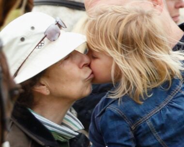 princess anne gives young blonde granddaughter kiss on the cheek