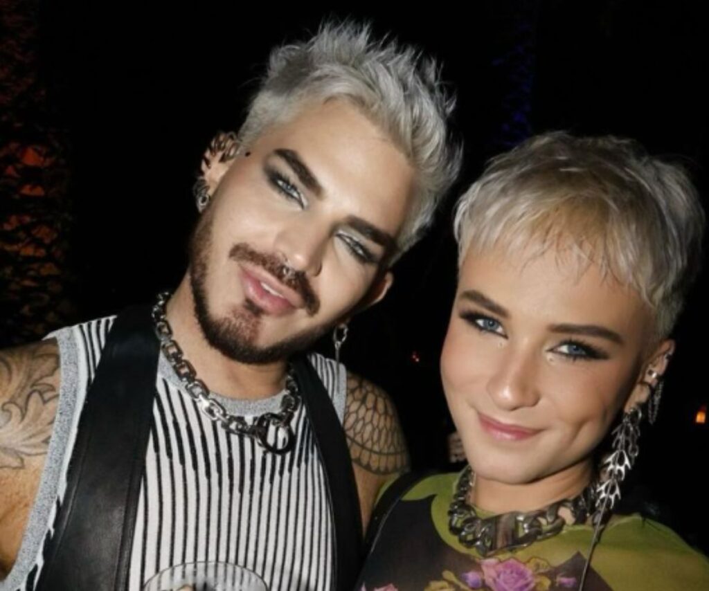 Adam Lambert with his boyfriend Oliver smile