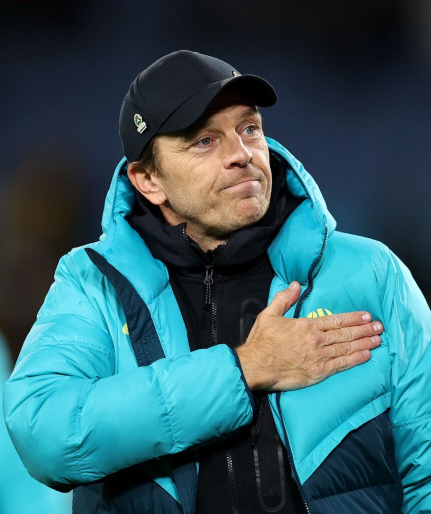 Tony Gustavvson, Matildas Coach, hand over heart, looks emotional in a blue puffy coat