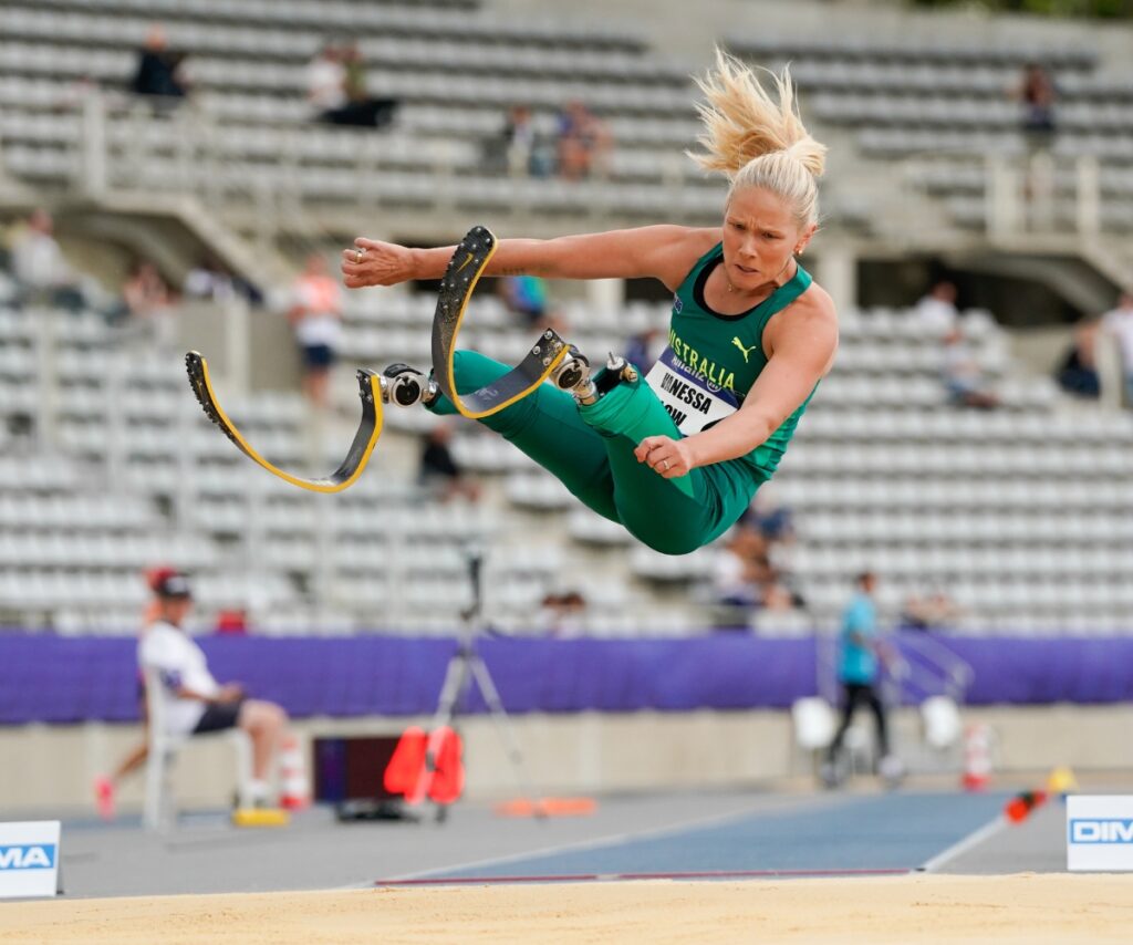 Vanessa Lowe jumping in the air during the long jump event at the Para Athletics World Championships in Paris 2023.