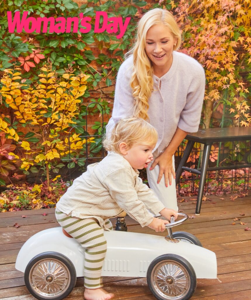 Vanessa Lowe smiling at her son Matteo who is in a small children's car.