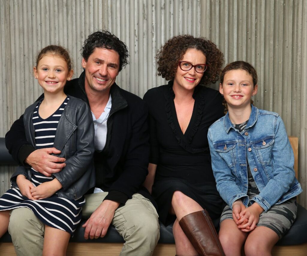 Colin Fassnidge with his wife and daughters. 