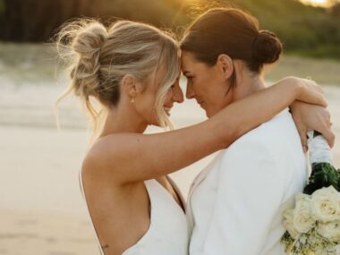 emily gielnik and temica's embrace at their wedding