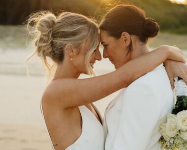 emily gielnik and temica's embrace at their wedding