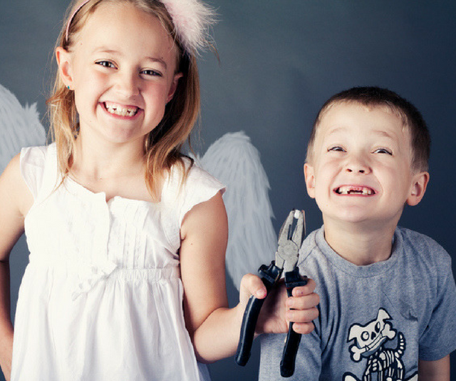 Young boy and girl pulling out teeth for a tooth fairy visit